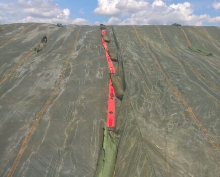 Gravel bag belts make covering silage clamps simpler and safer